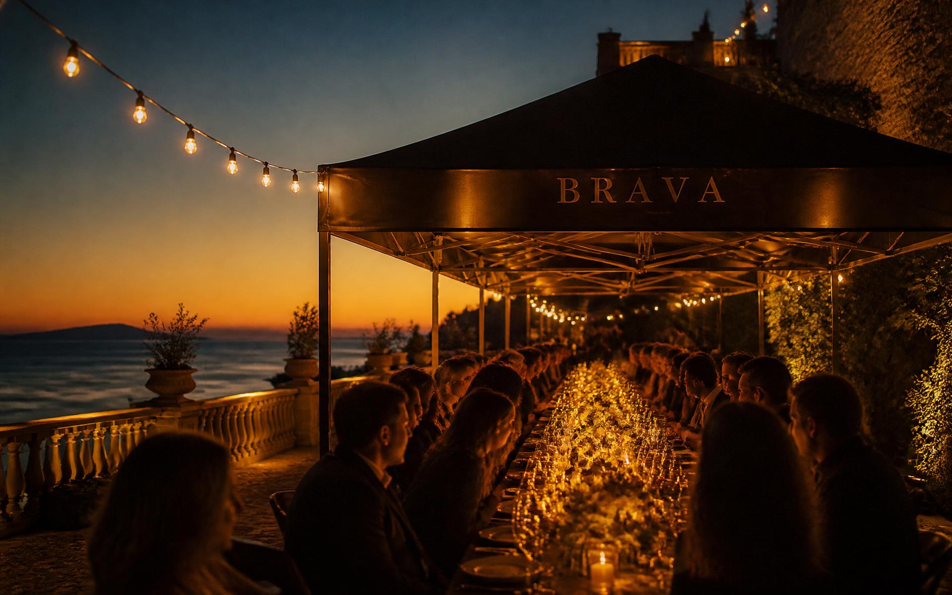 A long candlelit BRAVA table at dusk