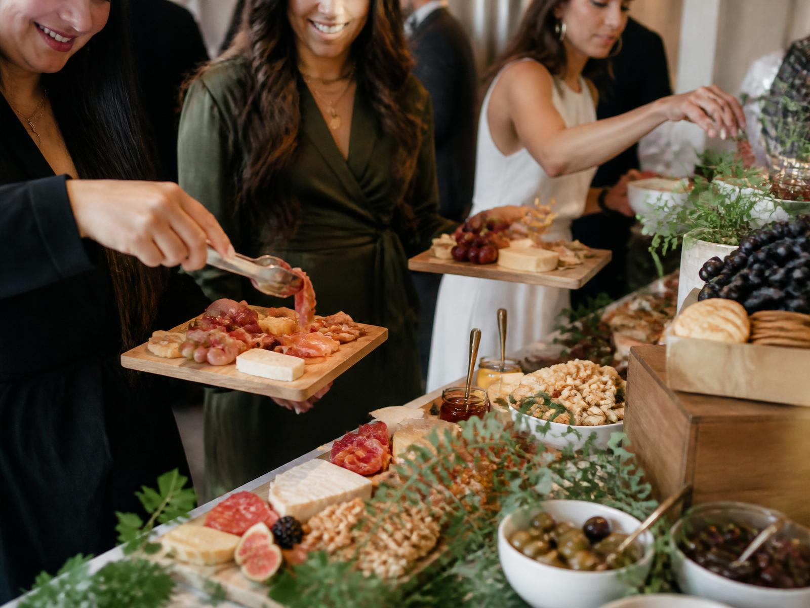 Guests building their own charcuterie boards